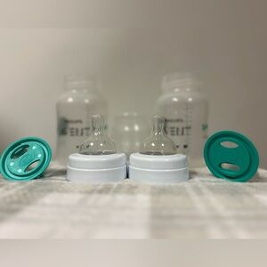 Two brand new baby bottles.